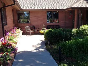 Front entrance of Chappelle Small Animal Hospital with garden seating in Fort Collins